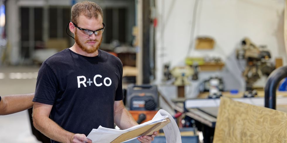 Renfrow+Co craftsmen discussing woodwork and ironworks